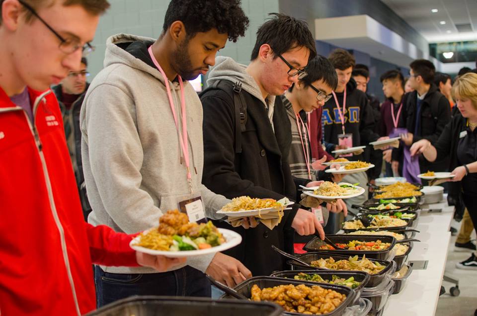 Attendees fill up on food to fuel them through the night